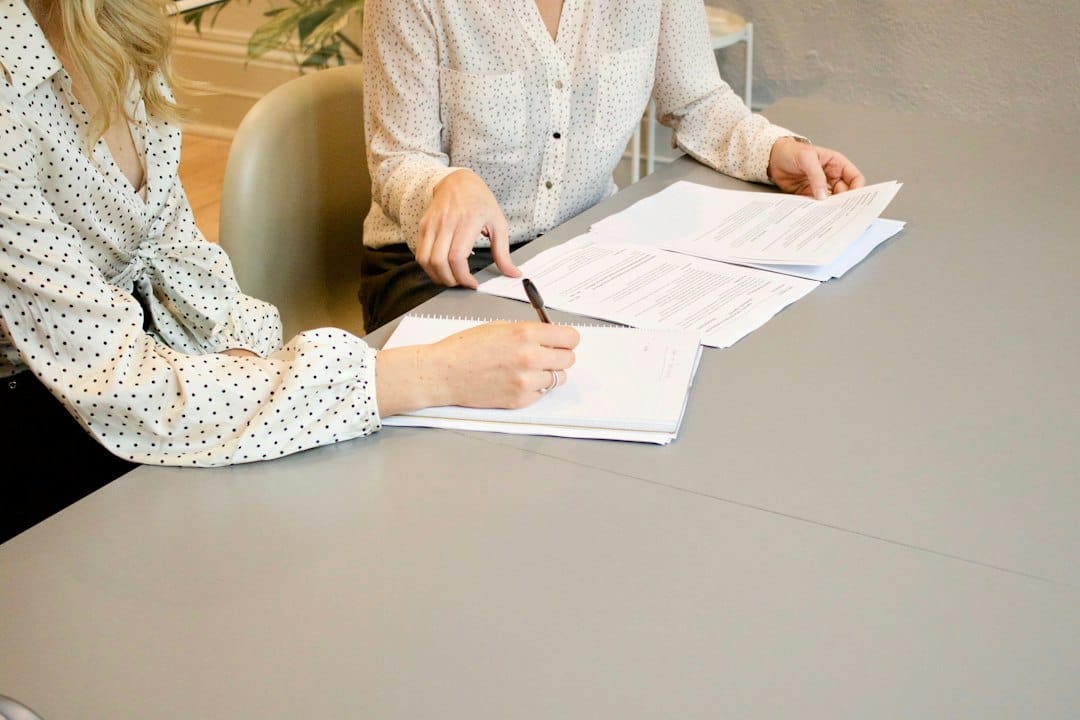 Patient reviewing paperwork and costs for dental treatment