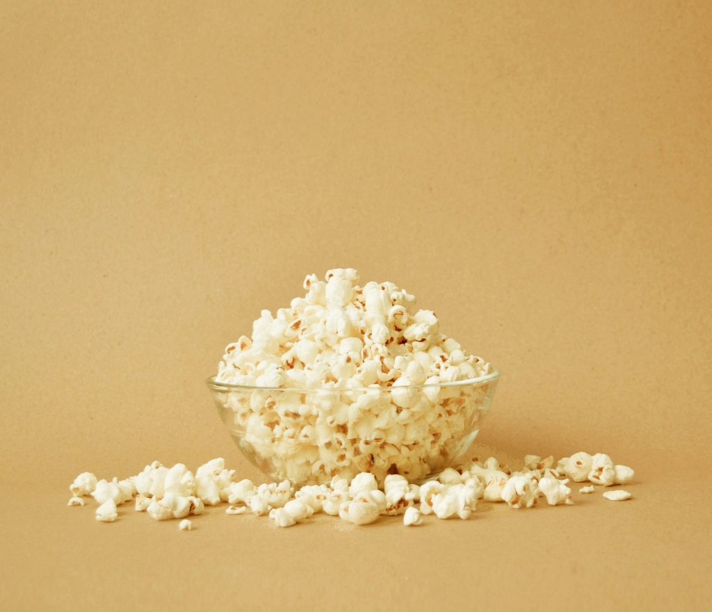 A bowl of popcorn illustrating why crunchy popcorn should be avoided during wisdom teeth recovery