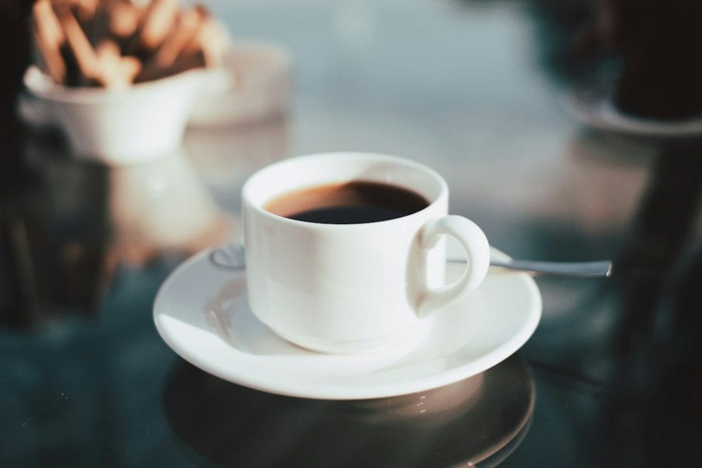 Cup of coffee illustrating the need to let hot drinks cool before drinking after wisdom teeth removal