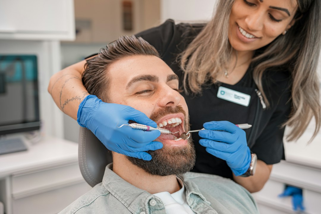 Dental professional preparing a patient for wisdom teeth removal